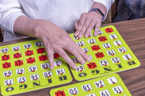 hands playing bingo